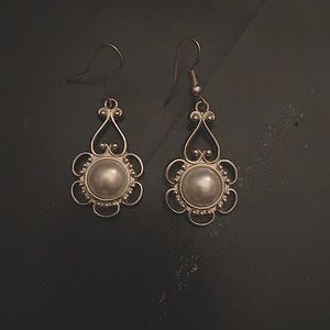 Sliver dangling earrings.